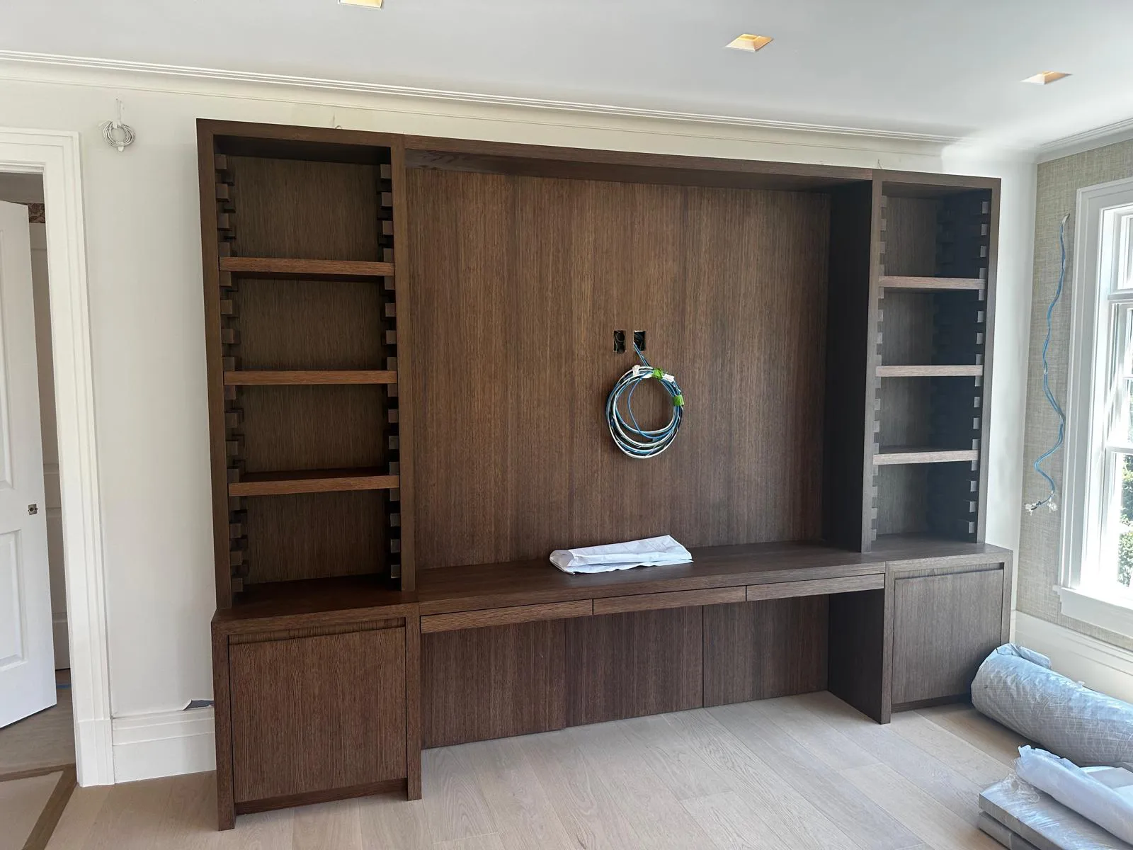 Custom built-in shelving installed by Hathaway Finish Carpentry in Massachusetts